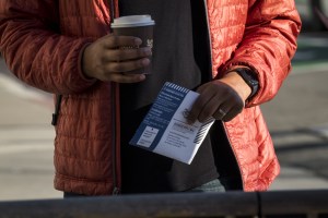 A voter drops off a mail-in ballot at City Hall in San Francisco, California, U.S., on Tuesday, March 3, 2020.​