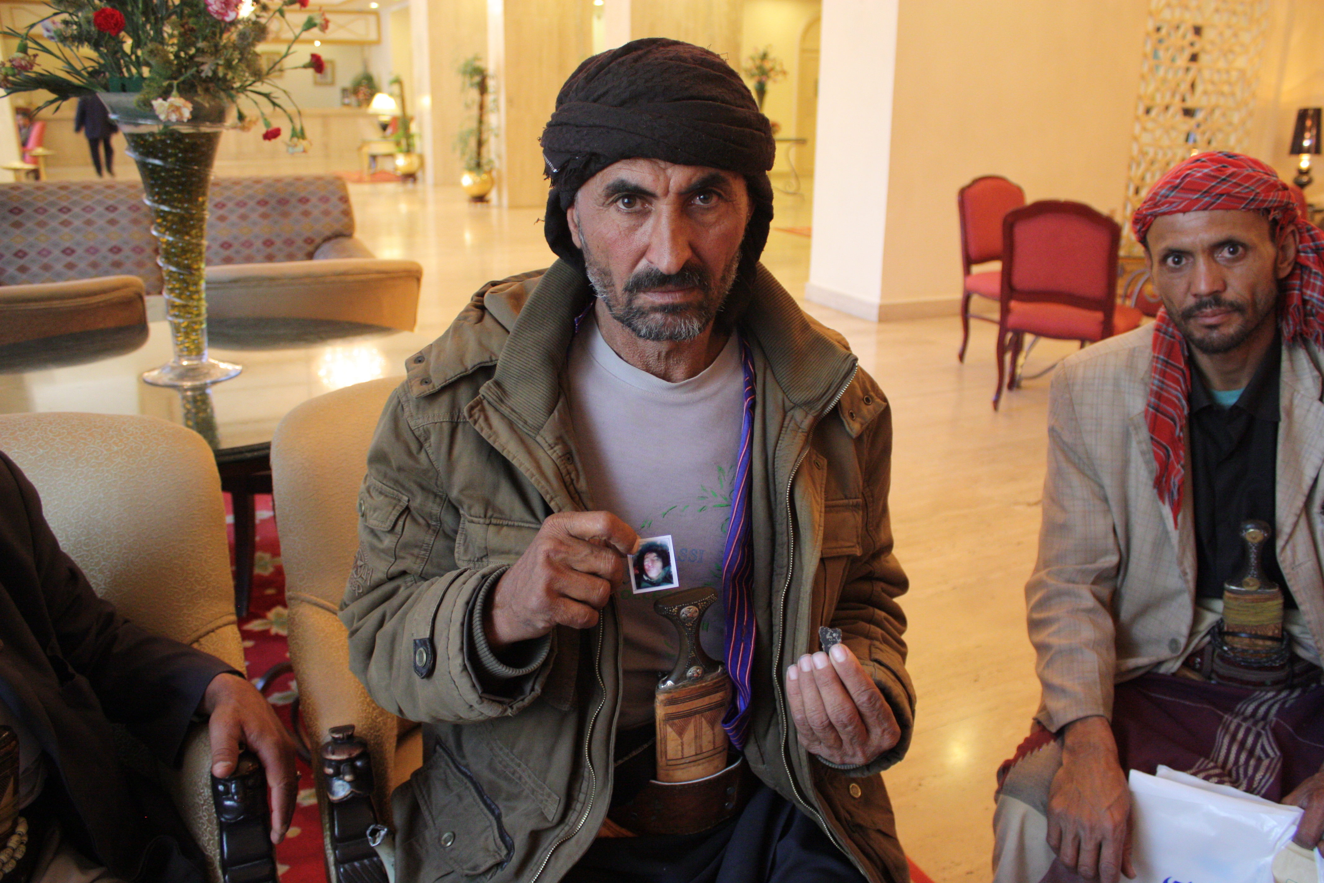 A man holds a picture.